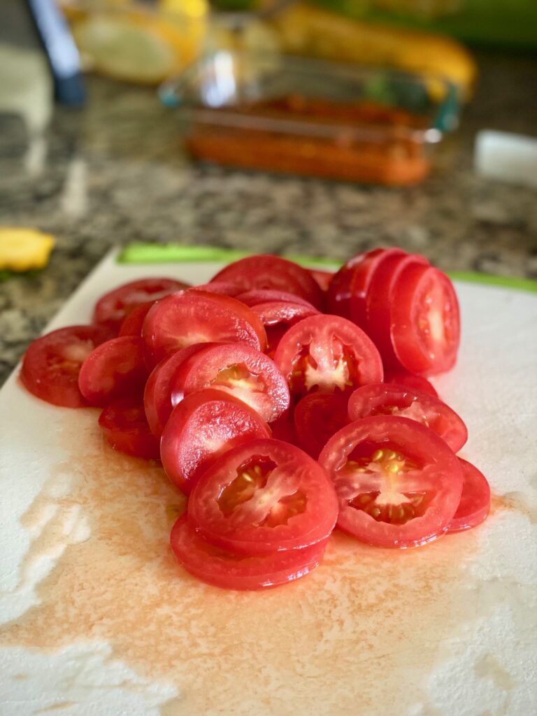 Sliced tomatoes on a cutting board