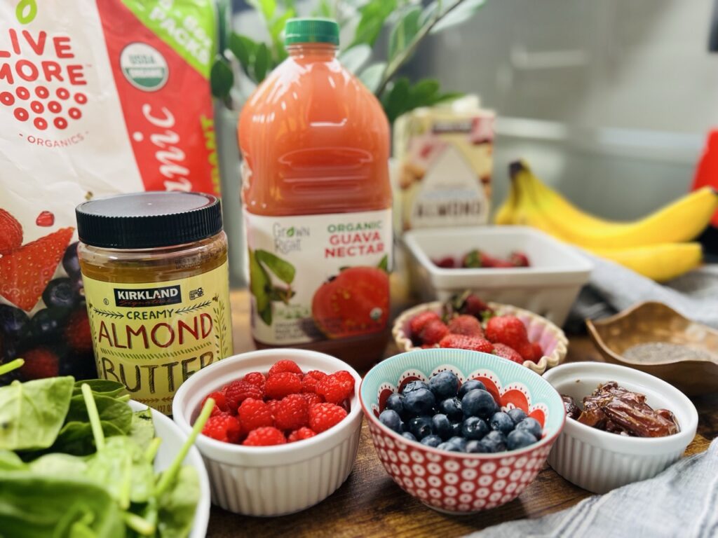 Chia berry smoothie ingredients which include bag of frozen berry antioxidant blend, almond butter, blueberries, raspberries, banana, spinach, guava nectar.