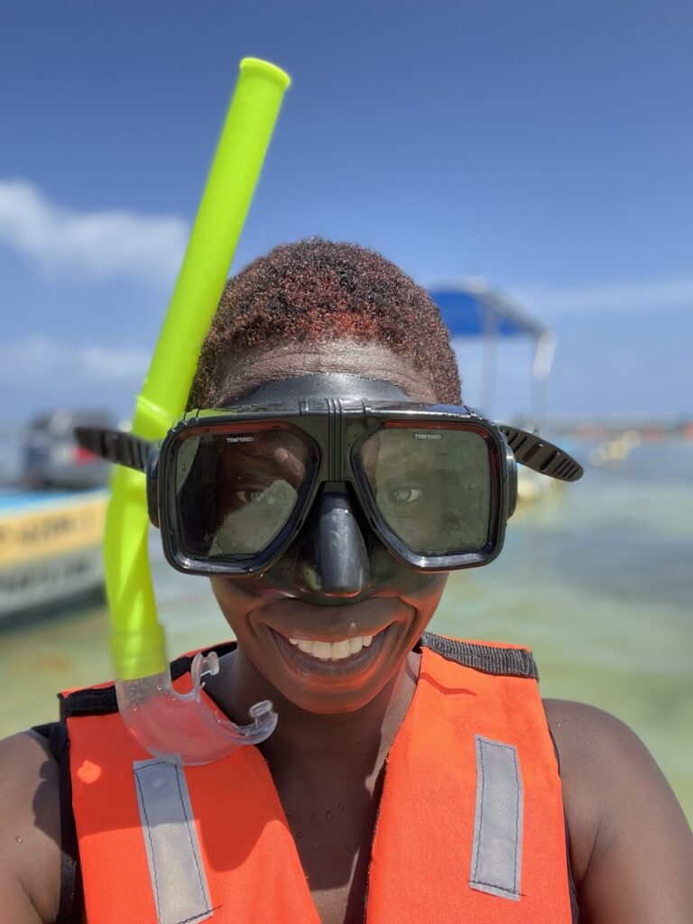 Lady with a life jacket and snorkel gear on