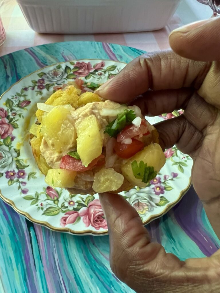 Tostones topped with pineapple, peppers and cilantro