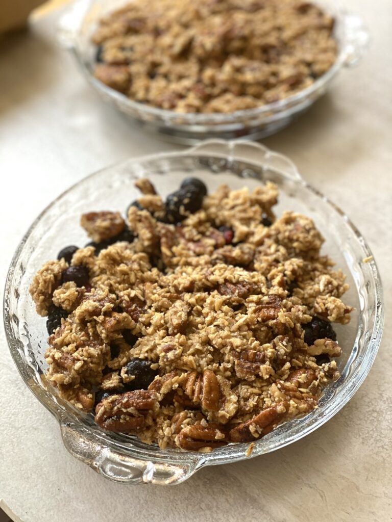 Unbaked Very Berry Crisp in a pie dish.
