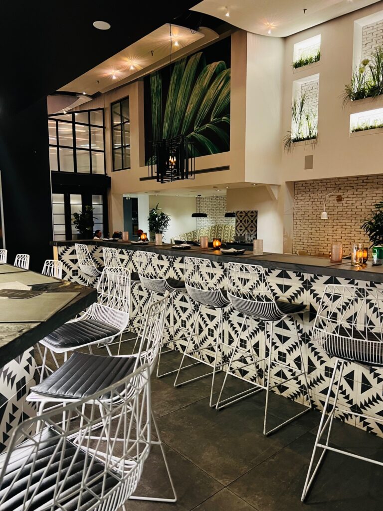 Picture of inside of Planta restaurant showing bar with stools