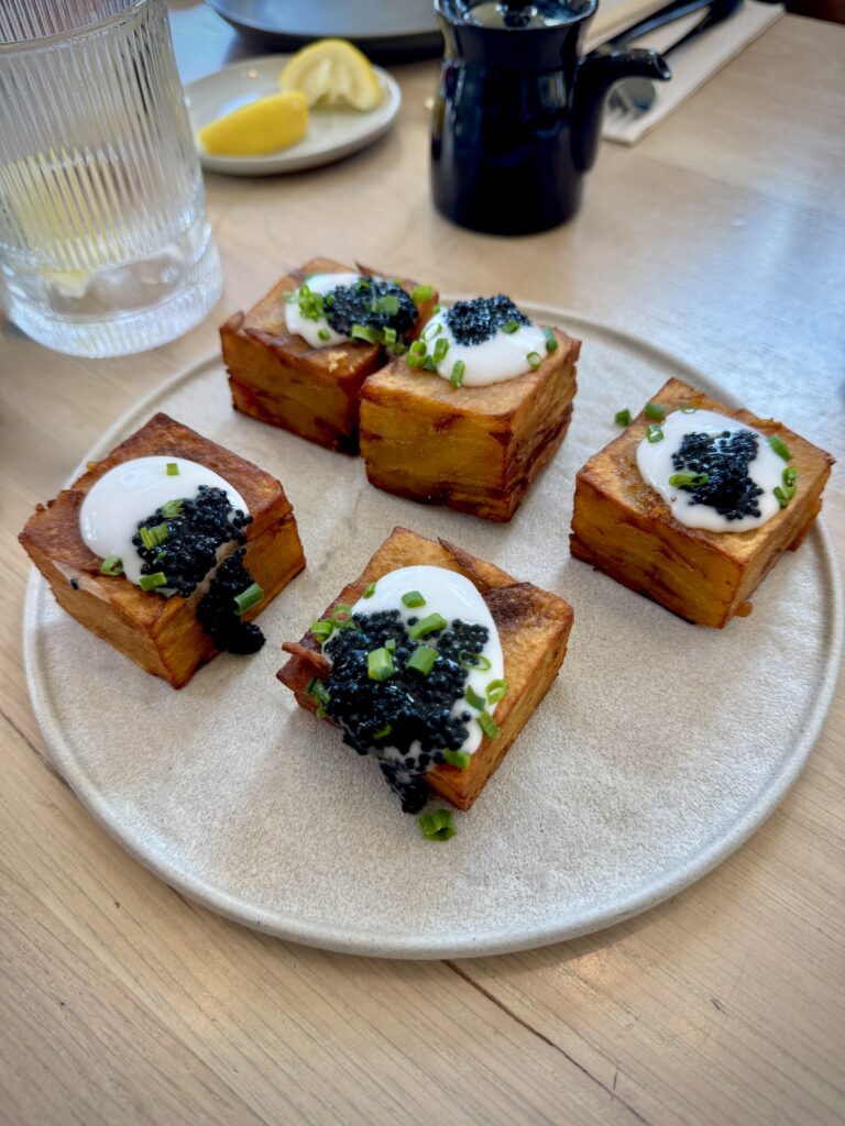 Thousand Layer Potatoes topped with vegan cream and caviar
