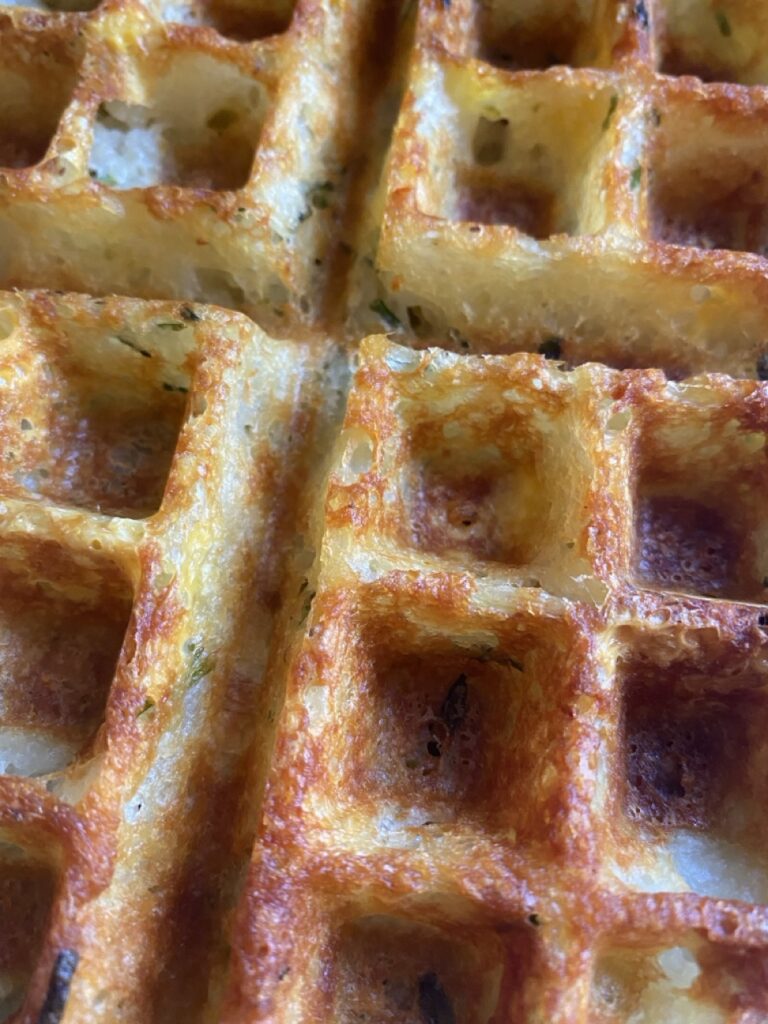 Close up of mashed potato waffles.