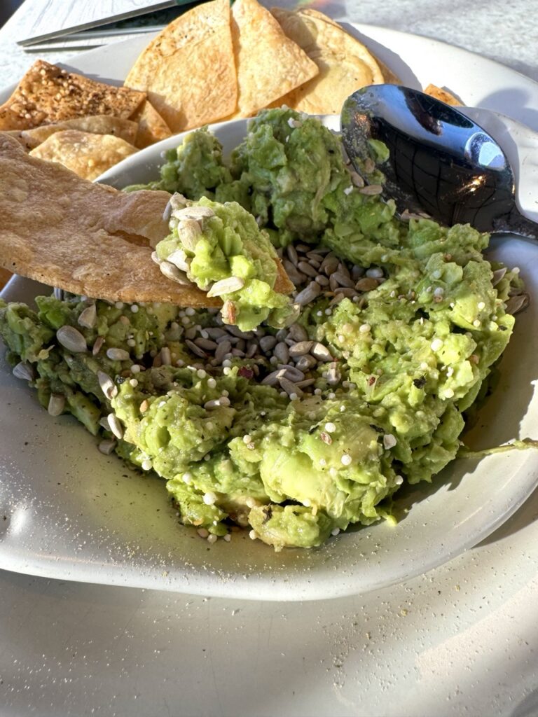 Edamame guacamole topped with chia and sunflower seeds.