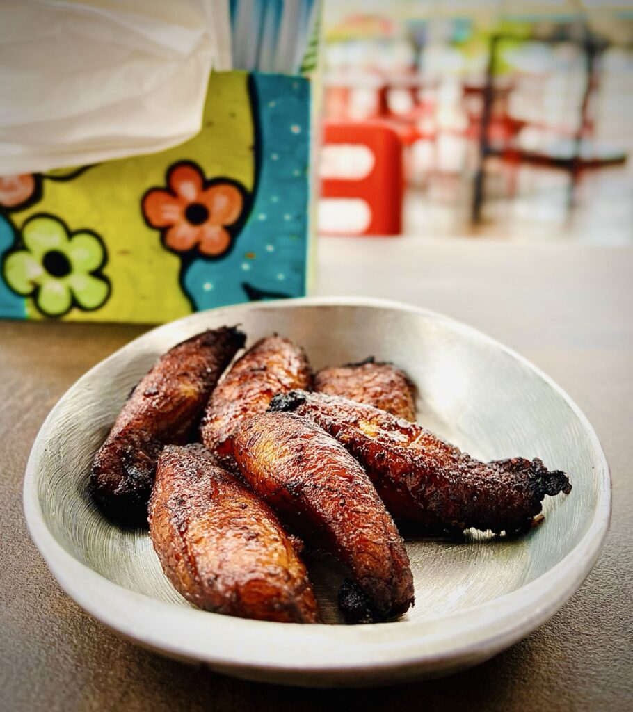 Plate filled with slices of fried plantain.