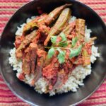 Okra cooked in tomato stew on a bed of brown rice.