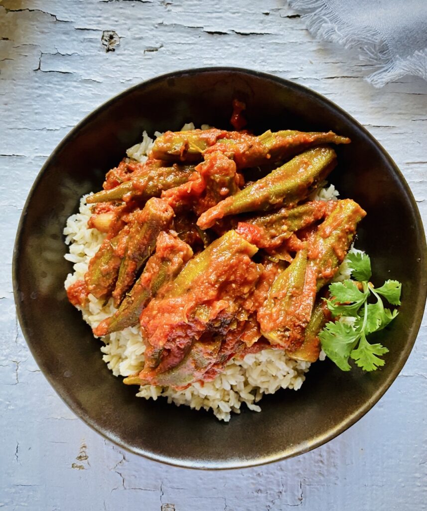 Okra cooked in tomato stew on a bed of brown rice.